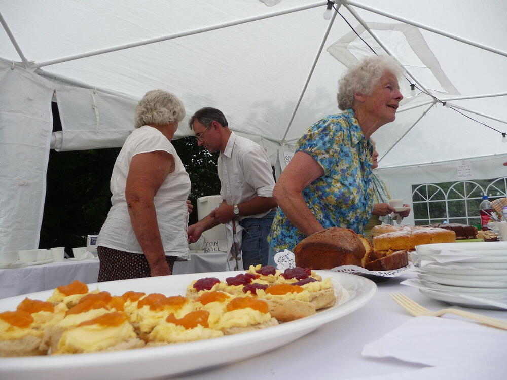 Volunteers serving cream teas at a village fete